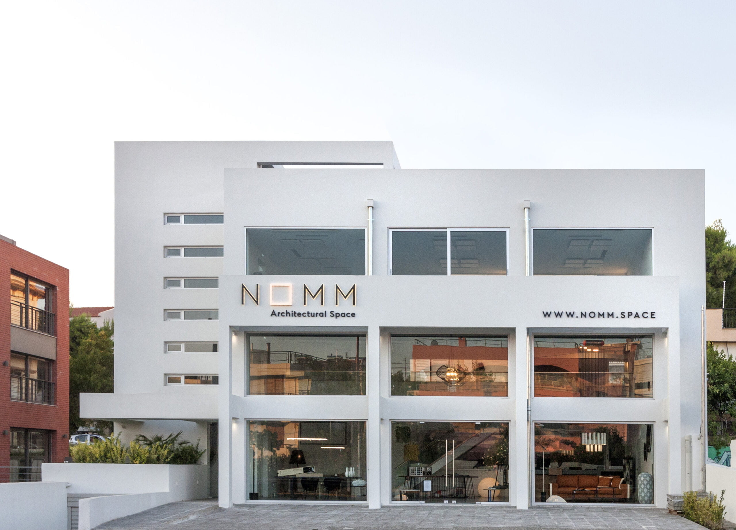 white three store building with big windows